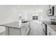 Modern kitchen with island, granite countertops, and stainless steel appliances at 2522 Linda Knoll Ln, Bartow, FL 33830