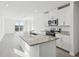 Modern kitchen with island, granite countertops, and stainless steel appliances at 2522 Linda Knoll Ln, Bartow, FL 33830