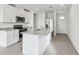 Modern kitchen with white cabinets, granite countertops, and stainless steel appliances at 2522 Linda Knoll Ln, Bartow, FL 33830