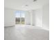 Bright living room with sliding glass doors and tile floor at 2522 Linda Knoll Ln, Bartow, FL 33830