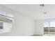 Open living area with sliding glass doors and tile floors at 2522 Linda Knoll Ln, Bartow, FL 33830
