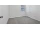 Cozy bedroom features carpet flooring, neutral walls, a window, and a standard closet at 2526 Linda Knoll Ln, Bartow, FL 33830