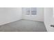 A bedroom bathed in natural light featuring neutral carpet floors at 2526 Linda Knoll Ln, Bartow, FL 33830