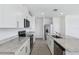 Bright kitchen boasts stainless steel appliances, granite counters, and white cabinets at 2526 Linda Knoll Ln, Bartow, FL 33830