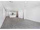 Spacious open-concept living area with tile floors, a kitchen, and plenty of natural light at 2526 Linda Knoll Ln, Bartow, FL 33830