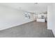 Bright, open living space with tile flooring, leading to a modern kitchen and dining area at 2526 Linda Knoll Ln, Bartow, FL 33830