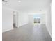Bright, open living area with sliding glass doors and tile flooring at 2526 Linda Knoll Ln, Bartow, FL 33830