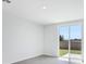 Minimalist room with a sliding glass door and simple interior design at 2526 Linda Knoll Ln, Bartow, FL 33830