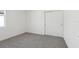 Well-lit bedroom featuring grey carpet and closet at 2534 Linda Knoll Ln, Bartow, FL 33830