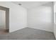 Spacious bedroom featuring grey carpet and an open door at 2534 Linda Knoll Ln, Bartow, FL 33830