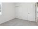 Bedroom with grey carpet, white walls, and double doors at 2534 Linda Knoll Ln, Bartow, FL 33830