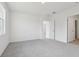 Bright bedroom featuring carpet and access to hallway at 2534 Linda Knoll Ln, Bartow, FL 33830