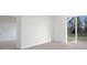 Bedroom with sliding glass doors, carpet, and backyard access at 2534 Linda Knoll Ln, Bartow, FL 33830