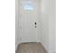 Bright entry with white door and wood-look tile floor at 2534 Linda Knoll Ln, Bartow, FL 33830