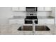 Modern kitchen with stainless steel sink and granite countertops at 2534 Linda Knoll Ln, Bartow, FL 33830
