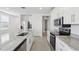 Modern kitchen with stainless steel appliances and granite countertops at 2534 Linda Knoll Ln, Bartow, FL 33830
