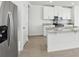 Kitchen features stainless steel refrigerator and granite island at 2534 Linda Knoll Ln, Bartow, FL 33830