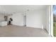 Spacious living room with wood-look floors and access to backyard at 2534 Linda Knoll Ln, Bartow, FL 33830