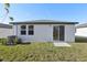 House exterior with sliding glass door and small backyard at 2538 Linda Knoll Ln, Bartow, FL 33830