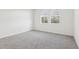 Spacious bedroom with grey carpet and two large windows at 2538 Linda Knoll Ln, Bartow, FL 33830