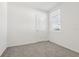 Spacious bedroom with grey carpet, a door and window with blinds at 2538 Linda Knoll Ln, Bartow, FL 33830
