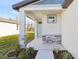 Front porch with light-colored door and stone accents at 2538 Linda Knoll Ln, Bartow, FL 33830