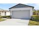 New gray garage door with stone accents at 2538 Linda Knoll Ln, Bartow, FL 33830