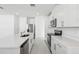 Modern kitchen with white cabinets and stainless steel appliances at 2538 Linda Knoll Ln, Bartow, FL 33830
