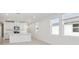 Open concept kitchen with island, lots of light, and white cabinetry at 2538 Linda Knoll Ln, Bartow, FL 33830