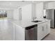 Open concept kitchen with island, stainless steel appliances, and white cabinetry at 2538 Linda Knoll Ln, Bartow, FL 33830
