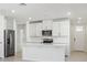 Modern kitchen with white cabinets, stainless steel appliances, and a large island at 2538 Linda Knoll Ln, Bartow, FL 33830