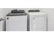 Laundry room with side-by-side Whirlpool washer and dryer at 2538 Linda Knoll Ln, Bartow, FL 33830