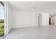 Open living room with tile floors and sliding glass doors at 2538 Linda Knoll Ln, Bartow, FL 33830