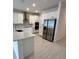 Spacious kitchen featuring stainless steel appliances and white cabinetry at 4946 Shady Pines Dr, Saint Cloud, FL 34772