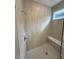 Large walk-in shower with built-in seat and tile surround at 4946 Shady Pines Dr, Saint Cloud, FL 34772