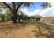 Charming single-story home with a mature tree and driveway at 1040 Santa Anita St, Orlando, FL 32808