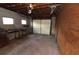 Spacious garage with concrete floor, workbench and door at 1040 Santa Anita St, Orlando, FL 32808