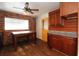 Eat in kitchen features granite countertops and a pop of color with its yellow door at 1040 Santa Anita St, Orlando, FL 32808