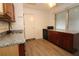 Eat in kitchen with granite countertops and black appliances at 1040 Santa Anita St, Orlando, FL 32808