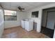 Enclosed laundry room with tile floor, and window with plenty of light for easy use at 1040 Santa Anita St, Orlando, FL 32808
