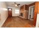 Cozy living room features hardwood floors and a classic brick fireplace at 1040 Santa Anita St, Orlando, FL 32808