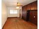 Bright living room with hardwood flooring, ceiling fan, and beautiful built in wood cabinetry at 1040 Santa Anita St, Orlando, FL 32808