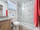 Updated bathroom featuring marble tile in shower at 1469 Swan Pl, Kissimmee, FL 34759
