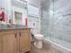Modern bathroom with a granite countertop and tiled shower at 1469 Swan Pl, Kissimmee, FL 34759