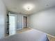 Bedroom with tile floor, large closet and view of another room at 1469 Swan Pl, Kissimmee, FL 34759
