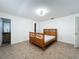 Bright bedroom featuring tiled flooring and a wooden bed frame at 1469 Swan Pl, Kissimmee, FL 34759