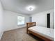 Bright bedroom with tiled floors and a wood frame bed at 1469 Swan Pl, Kissimmee, FL 34759