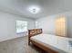 Bright bedroom with tiled floors and a wood frame bed at 1469 Swan Pl, Kissimmee, FL 34759