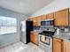 Kitchen with stainless steel appliances and wood cabinets at 1469 Swan Pl, Kissimmee, FL 34759