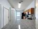 Open concept kitchen with granite countertops and stainless appliances at 1469 Swan Pl, Kissimmee, FL 34759